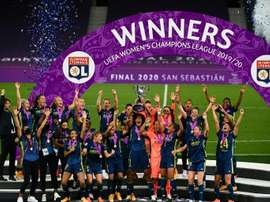 Lyon skipper Wendie Renard lifts the trophy after her team beat Wolfsburg. AFP