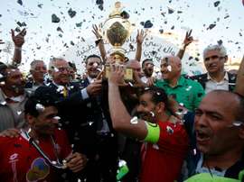 Players of Hebrons Ahly al-Khalil football club celebrate with the Palestinian Cup. AFP