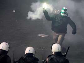 Riot police clashes with football fans during the game between Athens arch-rivals Olympiakos and Panathinaikos on February 22, 2015 in Athens
