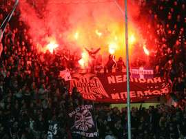 Paoks fans burn flares during the UEFA Europa League group stage football match PAOK FC Thessaloniki vs ACF Fiorentina at Toumpa Stadium in Thessaloniki on October 23, 2014