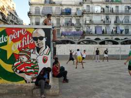 Algerians play football in Algiers Bab el-Oued neighbourhood, which is historically known to be a predominantly pro-Mouloudia Club Alger (MCA) area