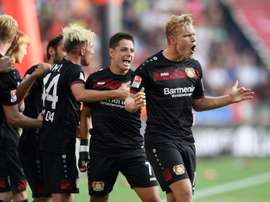 Leverkusens midfielder Joel Pohjanpalo and his teammates celebrate during German first division Bundesliga football match between Bayer 04 Leverkusen and Hamburger SV on September 10, 2016