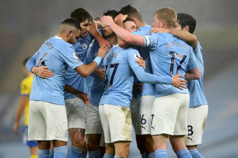 Premier League players are coming under increasing pressure not to celebrate goals by hugging. AFP