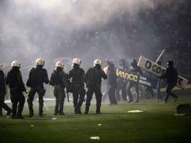 Panathinaikos fans clash with riot police after the cancellation of the Greek Super League match between Panathinaikos and Olympiakos in Athens on November 21, 2015