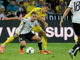 Germanys forward Mario Goetze (centre) vies with Ukraines defender Yevhen Khacheridi during their Euro 2016 match at the Stade Pierre Mauroy in Villeneuve-dAscq on June 12, 2016