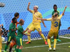 Sweden's Nilla Fischer celebrates scoring in the Rio 2016 Olympics. AFP