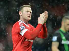 Manchester Uniteds English striker Wayne Rooney applauds at the end of the English Premier League football match between Manchester United and Stoke City at Old Trafford in Manchester, north west England, on February 2, 2016