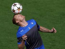 APOELs Norwegian defender John Arne Riise warms up with teammates during a training session at the GSP Stadium in the Cypriot capital Nicosia on November 24, 2014