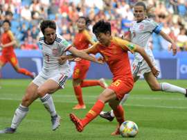 Spain's draw with China saw both teams advance. AFP