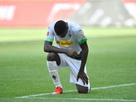 Gladbach go third as Thuram takes a knee in US killing protest. AFP