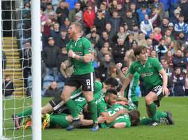 Lincoln Citys Sean Raggett celebrates with teammates. AFP