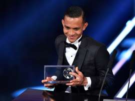 Penang FA and Malaysias midfielder Mohammed Faiz Subri holds his trophy. AFP