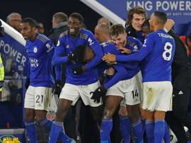 Iheanacho (C) was the hero for Leicester with a late winner. AFP