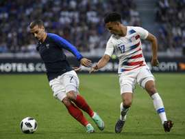 Antonee Robinson (R) has been ruled out for four weeks. AFP