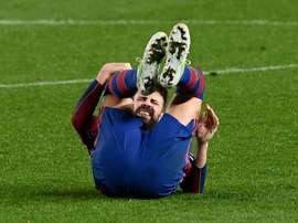 Piqué sofre uma entorse no joelho. AFP