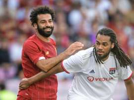 Mohamed Salah et Jason Denayer lors d'un match amical. AFP