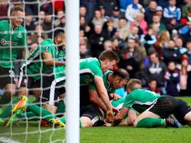Lincoln City players celebrating their success. Goal