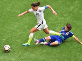 US player Carli Lloyd runs past Japan Aya Miyama during the Women World Cup final at BC Place Stadium in Vancouver.