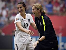 USA coach Jill Ellis (R) and midfielder Carli Lloyd celebrate after winning the FIFA World Cup final 5-2 against Japan at BC Place Stadium during in Vancouver on July 5, 2015